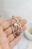 Rhodolite silver pendant with lotus flower