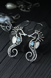 Seahorse silver earrings with topaz